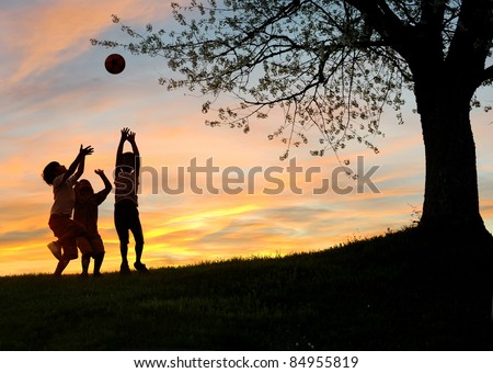 Children playing in sunset, silhouettes, freedom and happiness