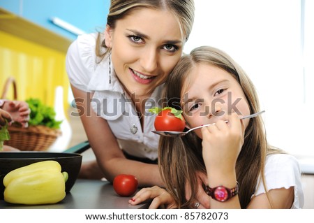 Mother and daughter cooking, love and work together