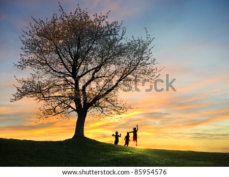 Children playing in sunset, silhouette, freedom and happiness