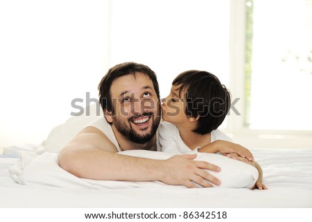 Father and son in bed, happy time