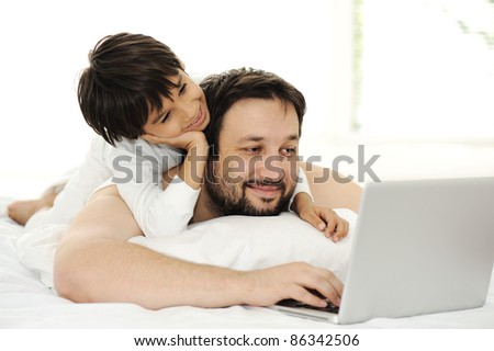 Father and son in bed, happy time
