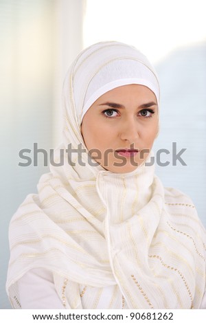 Young beautiful Muslim woman with traditional but fashionable clothes