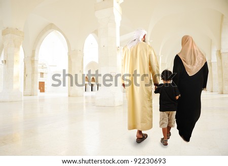 Arabic Muslim family walking indoor