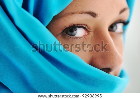Young beautiful muslim woman in blue scarf