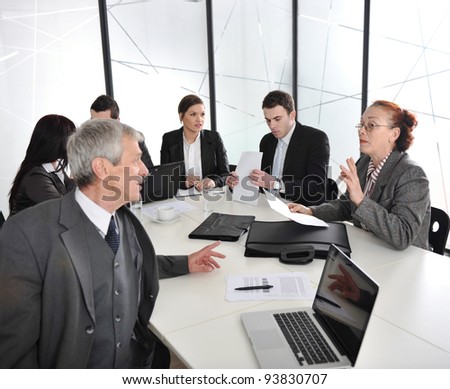 Senior businessman and businesswoman at a meeting. Open discussion between colleagues