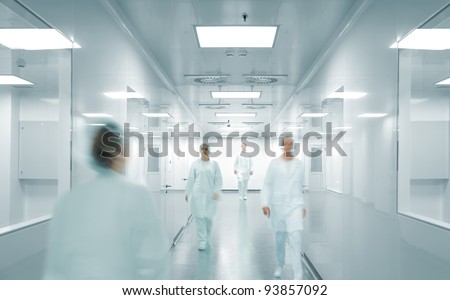 Scientists and doctors at modern pharmaceutical factory