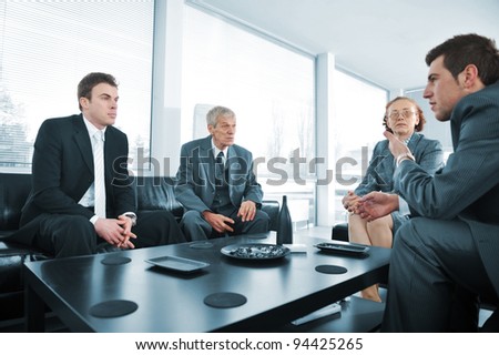 Business people having a break at office meeting