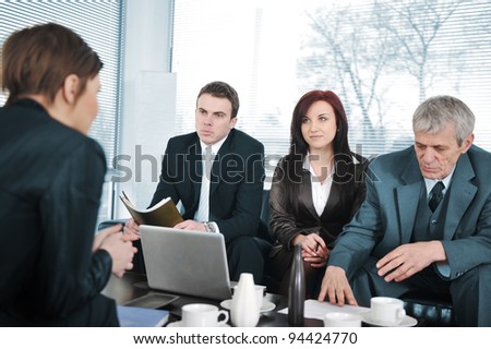 New employee in an interview with three business people