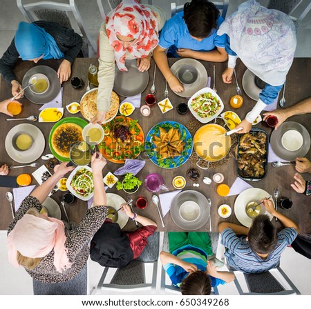 Top view of Muslim family gathering for eating iftar food in Ramadan