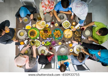 Top view of Muslim family gathering for eating iftar food in Ramadan