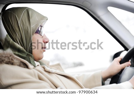 Muslim Arabic woman driving car