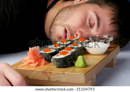 Rolls with salmon and octopus in black squared man sleeps, poisoned, badly, tastelessly