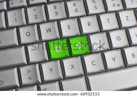 Computer keyboard with green go keys