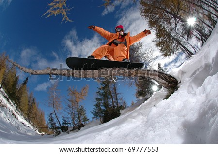 Extreme sports snowboarder jumping