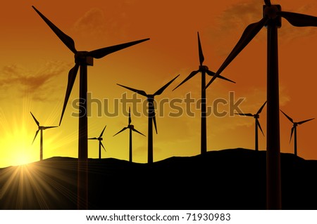 Wind turbines farm (power generating windmills) over sunset
