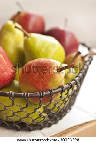 wire basket filled with pears