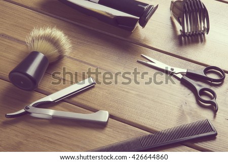 portrait of barber tools on wood top / essentials tools for barber