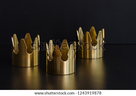 Three gold crowns, symbol of Tres Reyes Magos  ( Three Wise Men) who come bringing gifts for the kids on Epiphany or Dia de Reyes Magos.