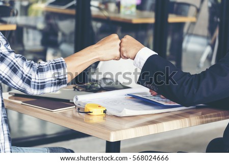 Business Partners Giving Fist Bump after complete a deal. Successful Teamwork