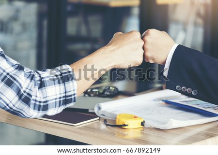 Business Partners Giving Fist Bump after complete a deal. Successful Teamwork Hands Gesture Concept. Partnership Business Concept.Fist Bump Colleagues Collaboration Teamwork