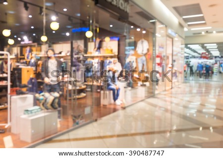 Blurred beautiful lobby at the malls. Blurred showcases fashion boutique with clothes. Blurred bokeh basic background for design.