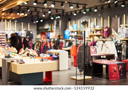 Blurred showcases fashion boutique with sportswear . Blurred bokeh basic background for design