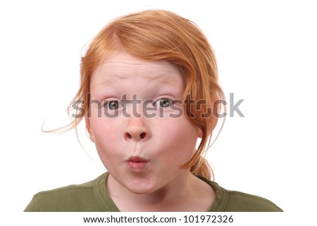 Young girl with eyes wide open on white background