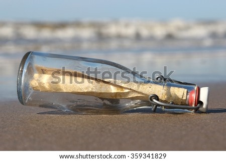 message in a bottle stranded on the beach