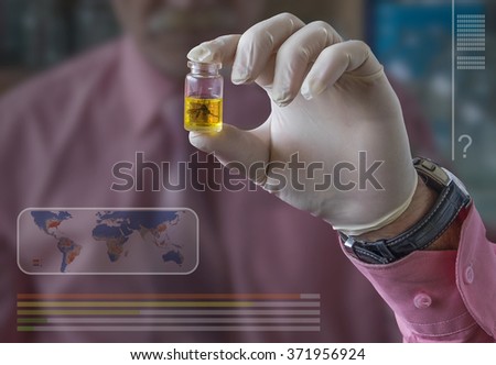 Dengue fever and Zika virus.Mosquito is in a test tube. There is a study on the presence of the virus. Specialist shows the tube with the specimen. The  spread virus worldwide.