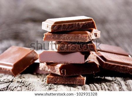 Chocolate pieces on wooden table
