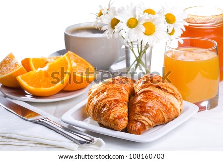 breakfast with croissants, orange juice and coffee