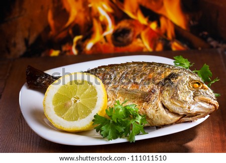 Grilled fish with lemon and parsley