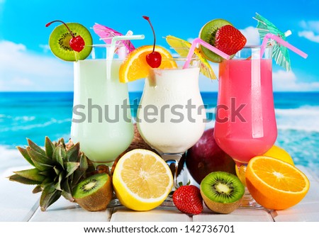 fruits cocktails on a beach