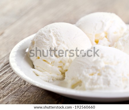 scoops of vanilla ice cream on a plate