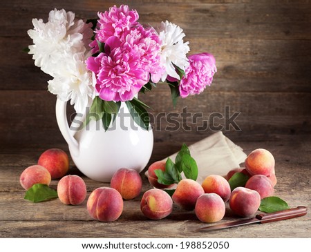 Still life with bouquet of peonies and peaches