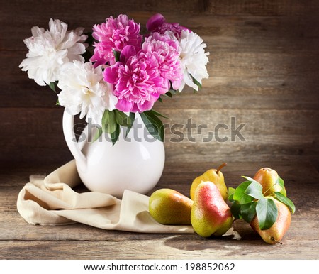 Still life with bouquet of peonies and pears