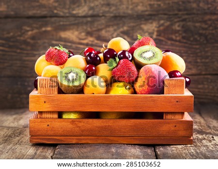 fresh fruits in wooden box