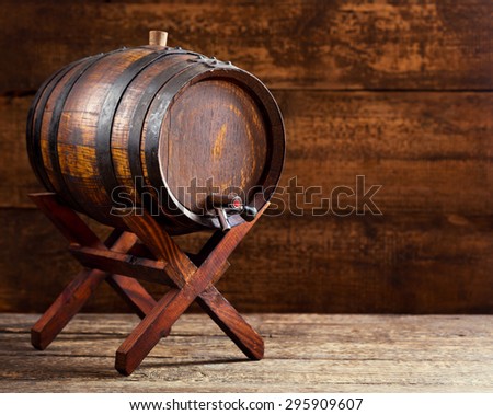 old wooden barrel on rustic wooden background