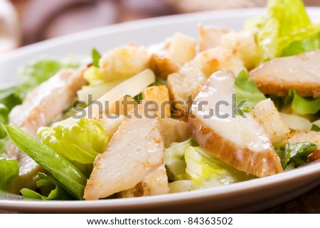 Caesar salad with chicken and greens