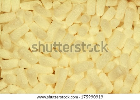 Background with white chips, which are used as packaging material.