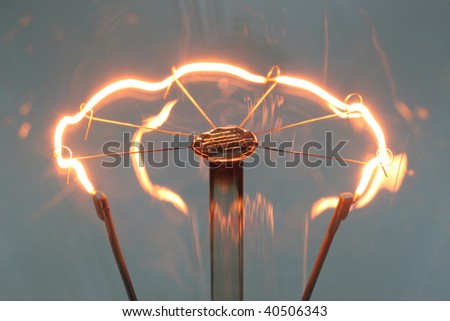 An old light bulb generates light and heat.