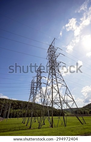 Tall electrical transmission towers at hydro-elecctric dam