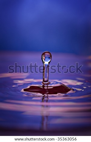 Colorful pink and blue water drop and splash