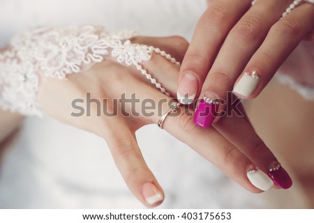 Wedding. diamond ring on the finger.  Beautiful manicure. Proposal for married. wedding  manicure, soft selective focus. gorgeous young bride at home. series.