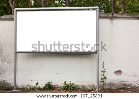 blank billboard on the city street in front of an old grunge wall, isolated on white background