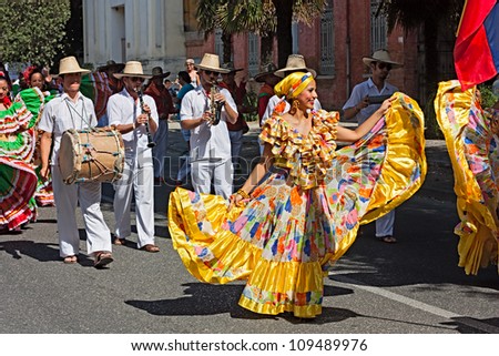 RUSSI, ITALY - AUGUST 5: street parade of ensemble Jocaycu from Colombia - colombian dancers in traditional dress performs folk dance at the International folk festival on August 5, 2012 in Russi RA, Italy