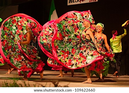 RUSSI, ITALY - AUGUST 5: ensemble Jocaycu from Colombia - colombian dancers in traditional dress performs popular dance at International folk festival on August 5, 2012 in Russi, Ravenna, Italy