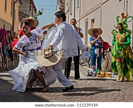 RUSSI, ITALY  - AUGUST 5:  A couple of Peruvian dancers in white dress performs traditional courting dance \