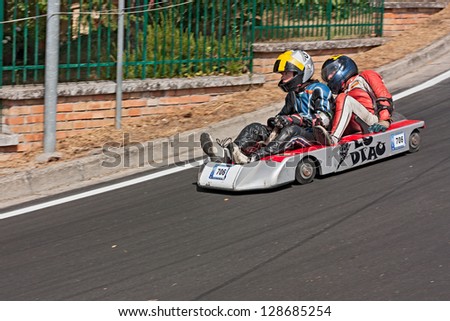 PREDAPIO ALTA, ITALY - JULY 28: unidentified drivers on a wooden soap box car race at european championship speed down on July 28, 2012 in Predappio Alta, FC, Italy