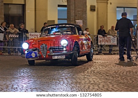 MELDOLA (FC), ITALY - SEPTEMBER 21: vintage car Alfa Romeo Giulia Spider (1963) at night in rally Gran Premio Nuvolari 2012, endurance race for old cars, on September 21, 2012 in Meldola (FC), Italy